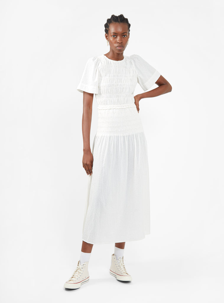 Model wears the white Siempre Smock Maxi Dress from Apiece Apart