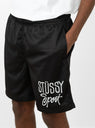 stussy sport mesh trousers on model up close 