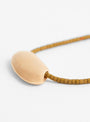 Flat Oval Gold Plated Pendant and Miyuki Chain Olive from Helene Rohner at Couverture & The Garbstore
Close-up