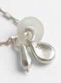 Baba Charm Necklace Clear by Lizzie Ames at Couverture & The Garbstore
Detail