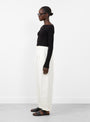 Bari Crop Trouser in Cream from Apiece Apart at Couverture & The Garbstore model side 