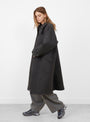 The Tyrell Wool Trench Coat in Grey Melange from YMC at Couverture & The Garbstore
Model Side