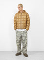The Midweight Hooded Puffer from Stüssy in Khaki at Couverture & The Garbstore Model Front 
