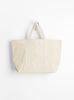 The Base Field Tote (L) from This is (an) arrives in White at Couverture & The Garbstore
back