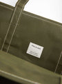 The Base Field Tote (L) from This is (an) arrives in Olive at Couverture & The Garbstore
label