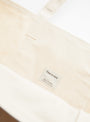 The Base Field Tote (L) from This is (an) in Black and White at Couverture & The Garbstore
label