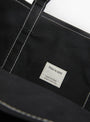 The Base Field Tote (L) from This is (an) in Black and Black at Couverture & The Garbstore
label
