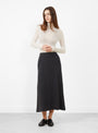 The Flat Stitch Semi Circle Knit Skirt Melange Black from Modern Weaving at Couverture & The Garbstore
model front 
