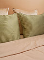 The Mulberry Silk Pillowcase from Emily's Pillow comes in Green Vichy at Couverture & The Garbstore
bed 