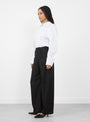 The Soline Wool Trousers in Black by Sefr from Couverture and the Garbstore 
model side