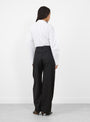 The Soline Wool Trousers in Black by Sefr from Couverture and the Garbstore 
model back