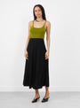 The No 470 Seduce Knit Skirt comes in Raven from Extreme Cashmere at Couverture & The Garbstore
model front 