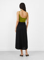 The No 470 Seduce Knit Skirt comes in Raven from Extreme Cashmere at Couverture & The Garbstore
model back