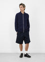 Slippery Knit Navy from Howlin' at Couverture & The Garbstore
model front 