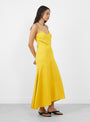 The Kasimira Bias Slip Dress comes in Goldenrod from Apiece Apart at Couverture & The Garbstore
model side