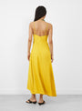 The Kasimira Bias Slip Dress comes in Goldenrod from Apiece Apart at Couverture & The Garbstore
model back