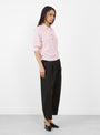The Oda Polo Knit comes in Rosewater from Apiece Apart at Couverture & The Garbstore
model side