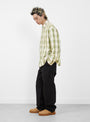 The Lau Plaid Shirt Jacket from Stüssy comes in Off White at Couverture & The Garbstore
model side