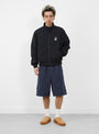 The Striped Beach Short from Stüssy comes in Navy at Couverture & The Garbstore
model front
