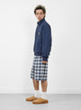 The Plaid Beach Short from Stüssy comes in Blue at Couverture & The Garbstore
model side