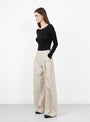 The Nantia Trouser from Séfr comes in Austre Beige at Couverture & The Garbstore
model side