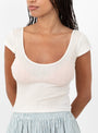 The Kaia Two Way Wrap Cap Sleeve T-Shirt in White from Malu at Couverture and The Garbstore
model detail