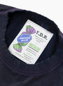 The American Waste T-Shirt from TDR comes in Navy at Couverture & The Garbstore
label