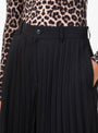 Herringbone Pleated Shorts Black Black TOGA (model close up) at Couverture & The Garbstore