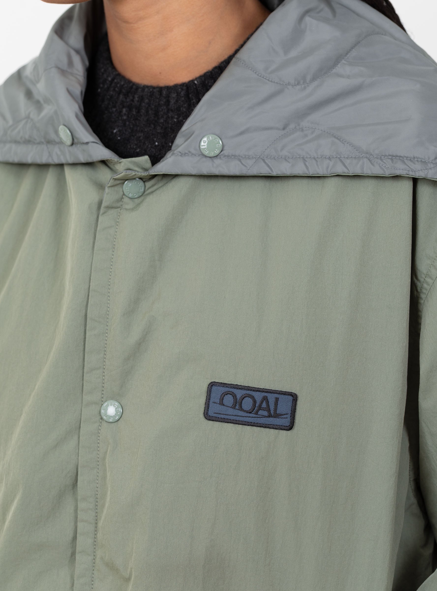 W Quilting Bench Coat Sage Green Sage Green Nanamica (logo detail) at Couverture & The Garbstore