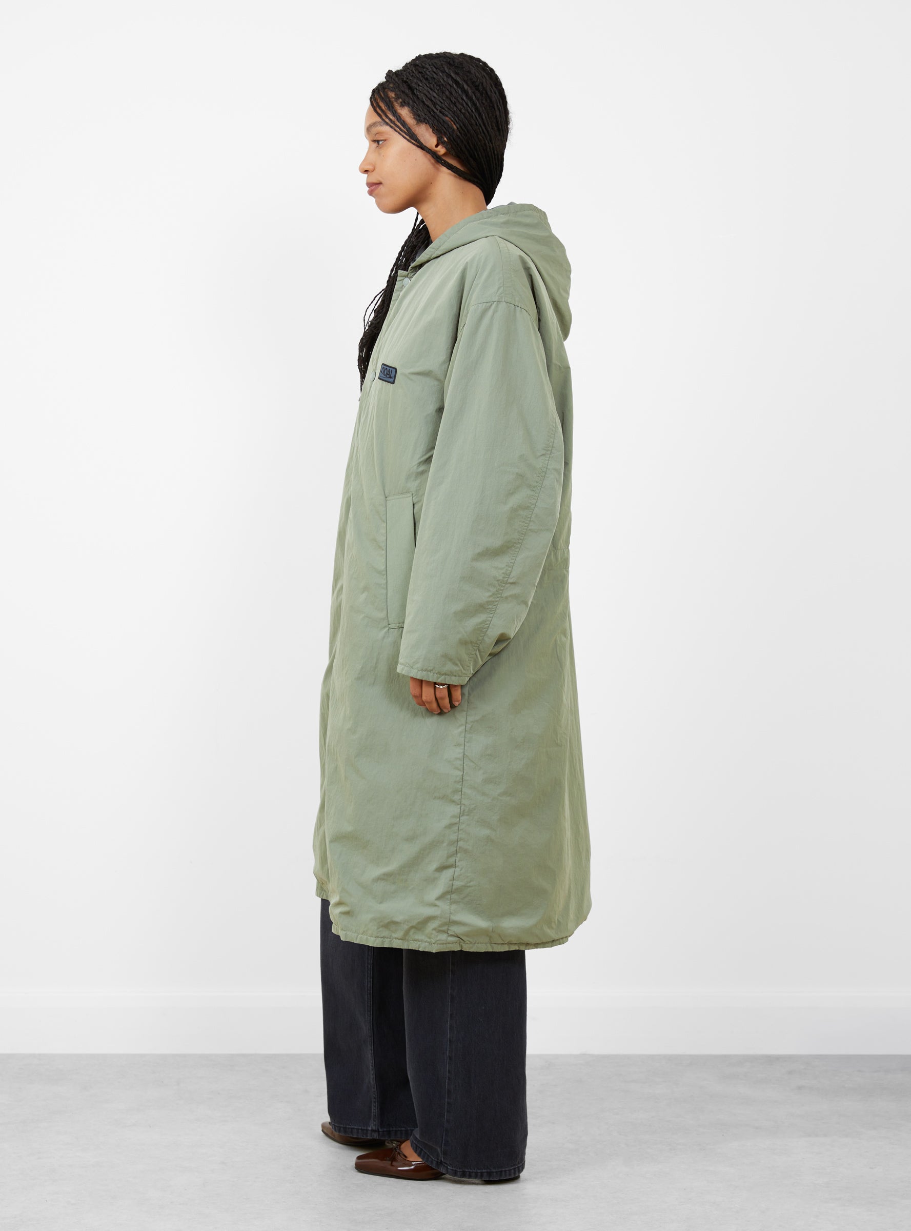 W Quilting Bench Coat Sage Green Sage Green Nanamica (model side) at Couverture & The Garbstore
