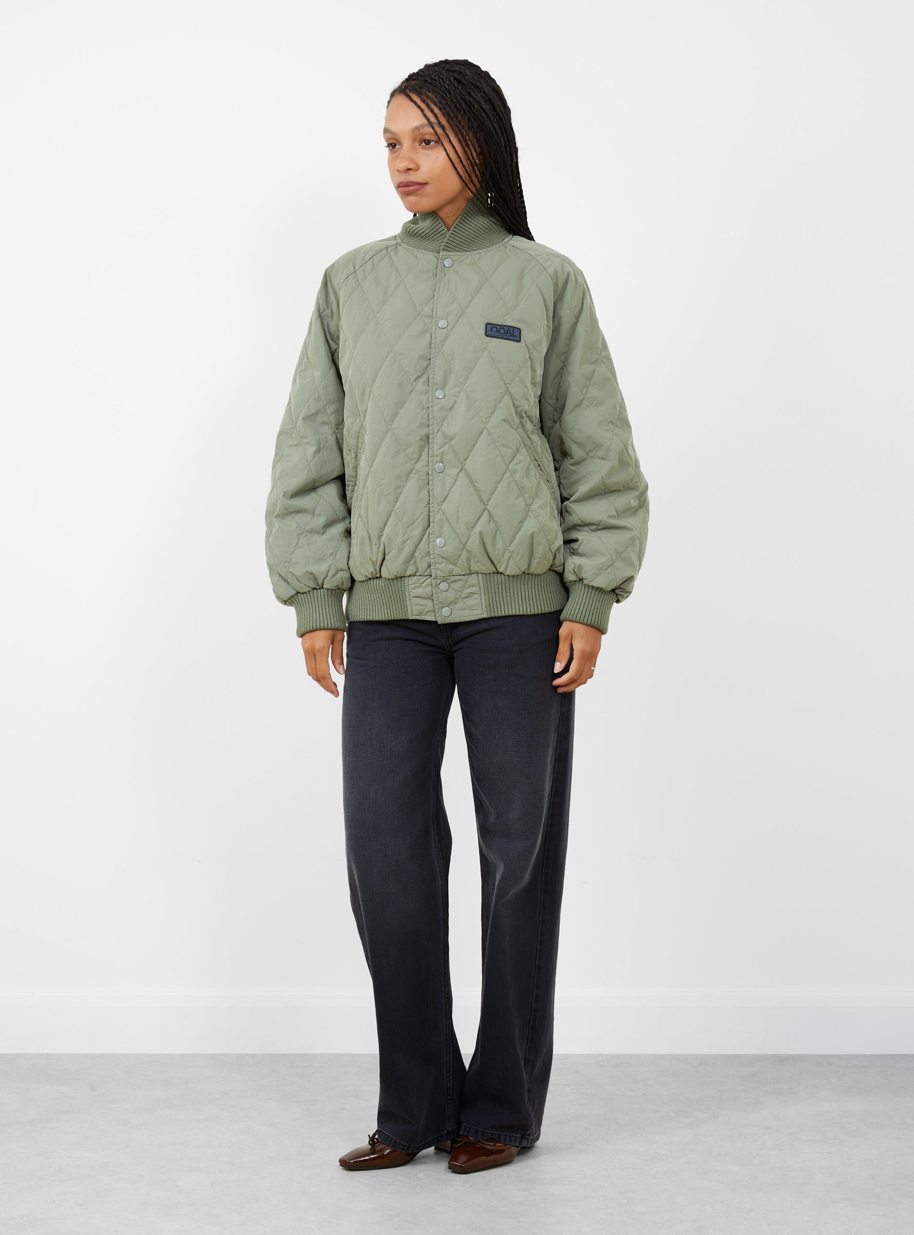 W Quilting Varsity Jacket Sage Green Sage Green Nanamica (model front) at Couverture & The Garbstore