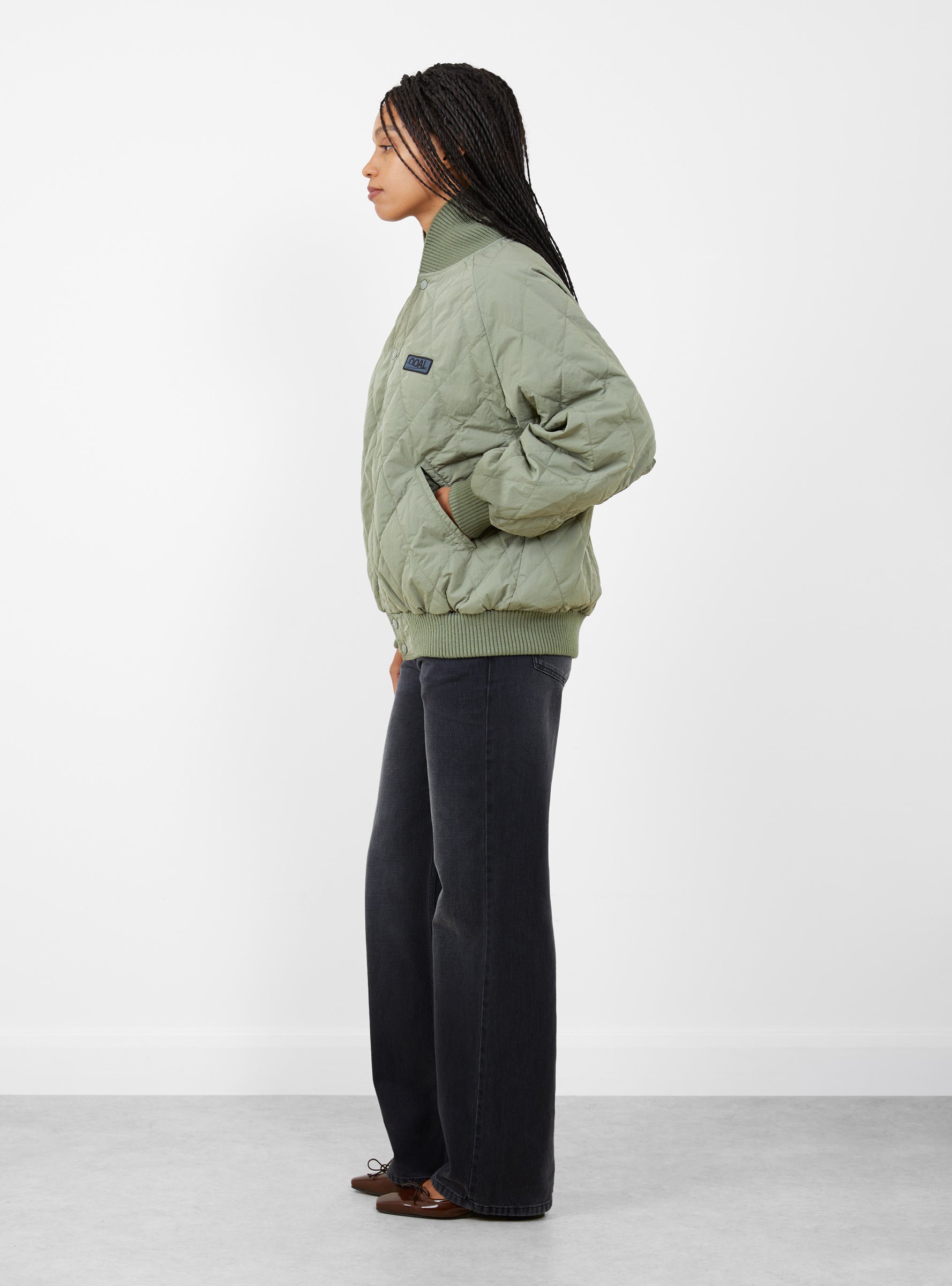 W Quilting Varsity Jacket Sage Green Sage Green Nanamica (model side) at Couverture & The Garbstore