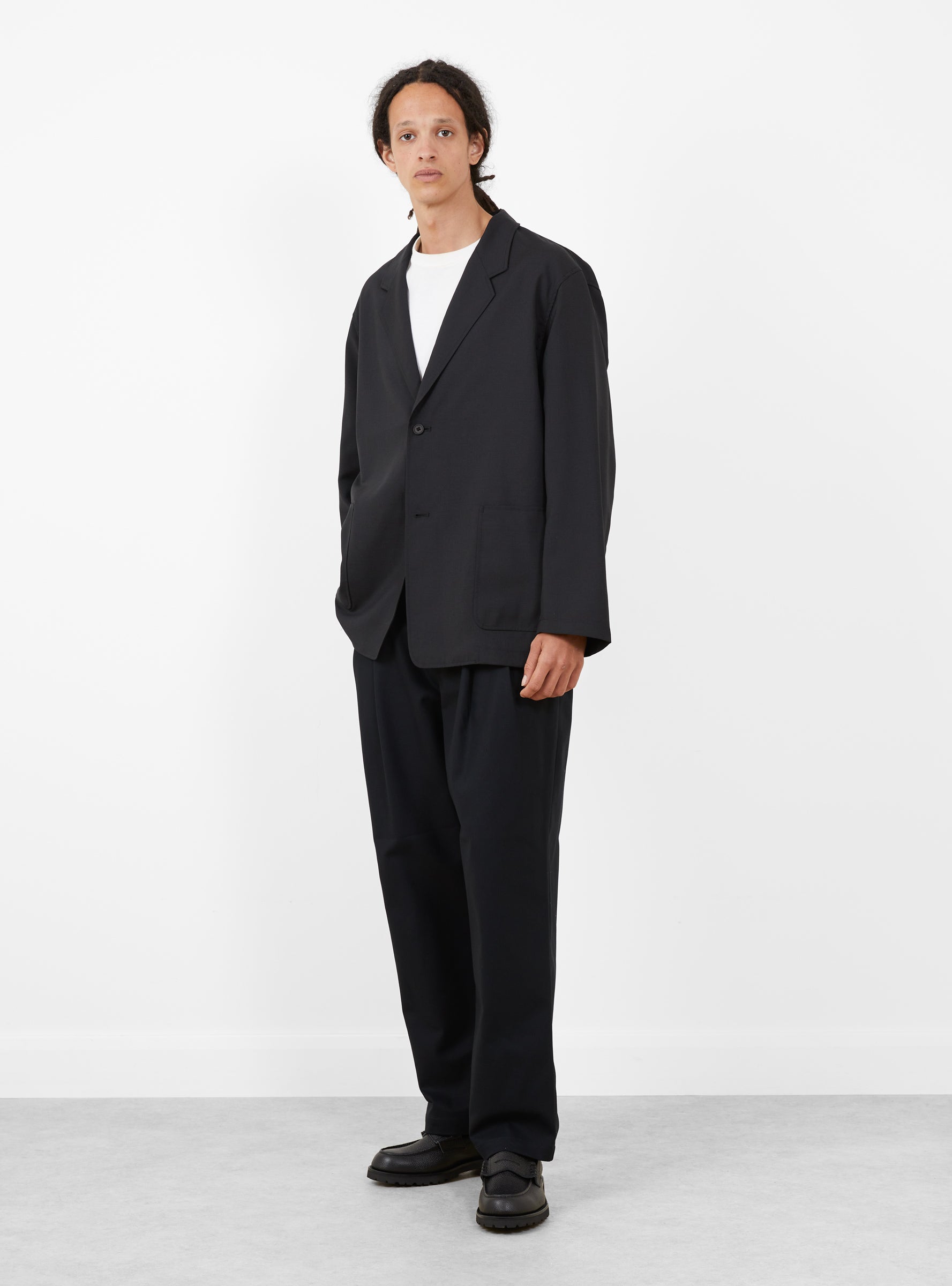 Relaxed 2 Pleat Pants Ink Black STILL BY HAND (model front) at Couverture & The Garbstore