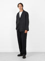 Relaxed 2 Pleat Pants Ink Black STILL BY HAND (model front) at Couverture & The Garbstore