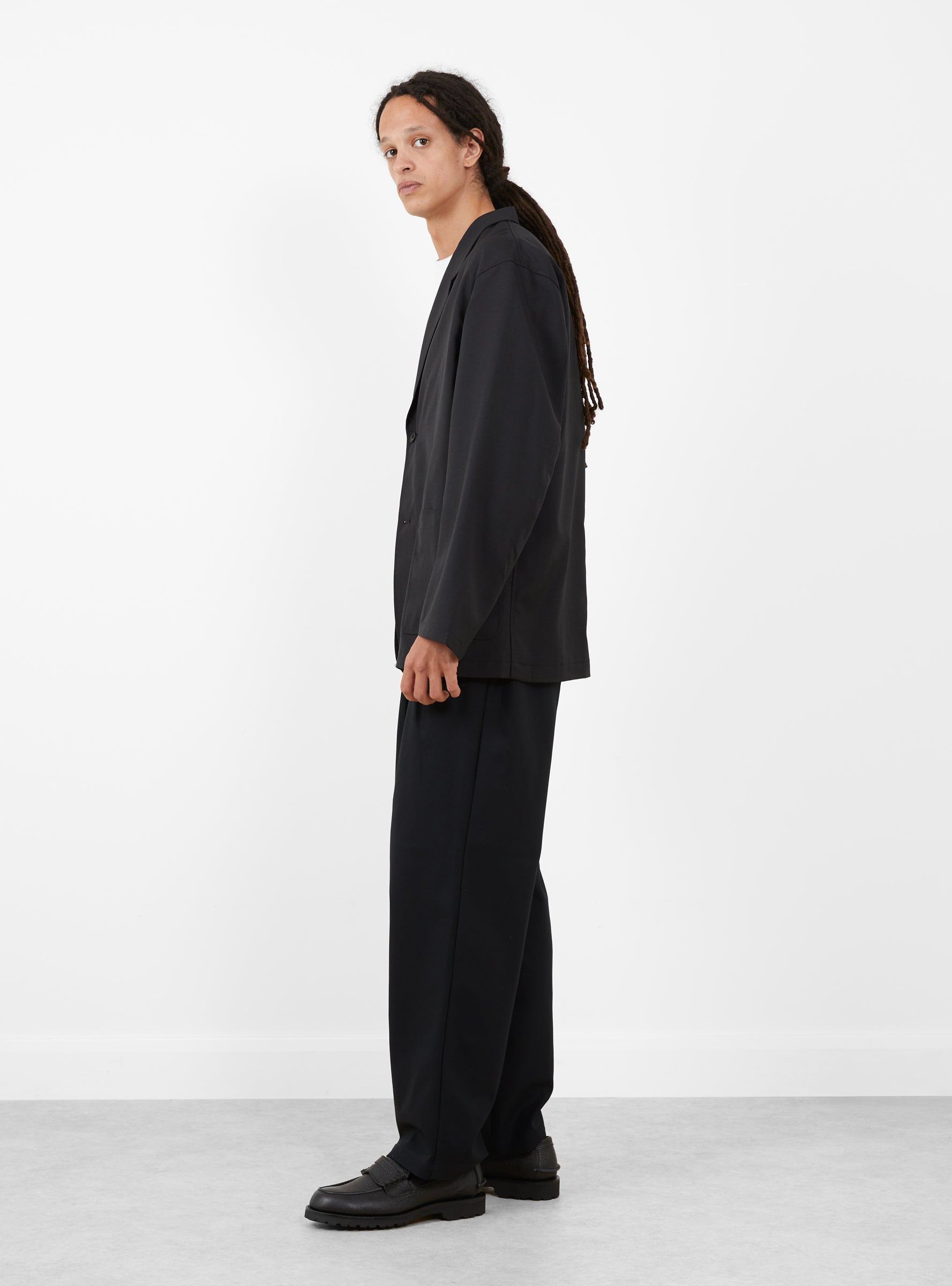 Relaxed 2 Pleat Pants Ink Black STILL BY HAND (model side) at Couverture & The Garbstore