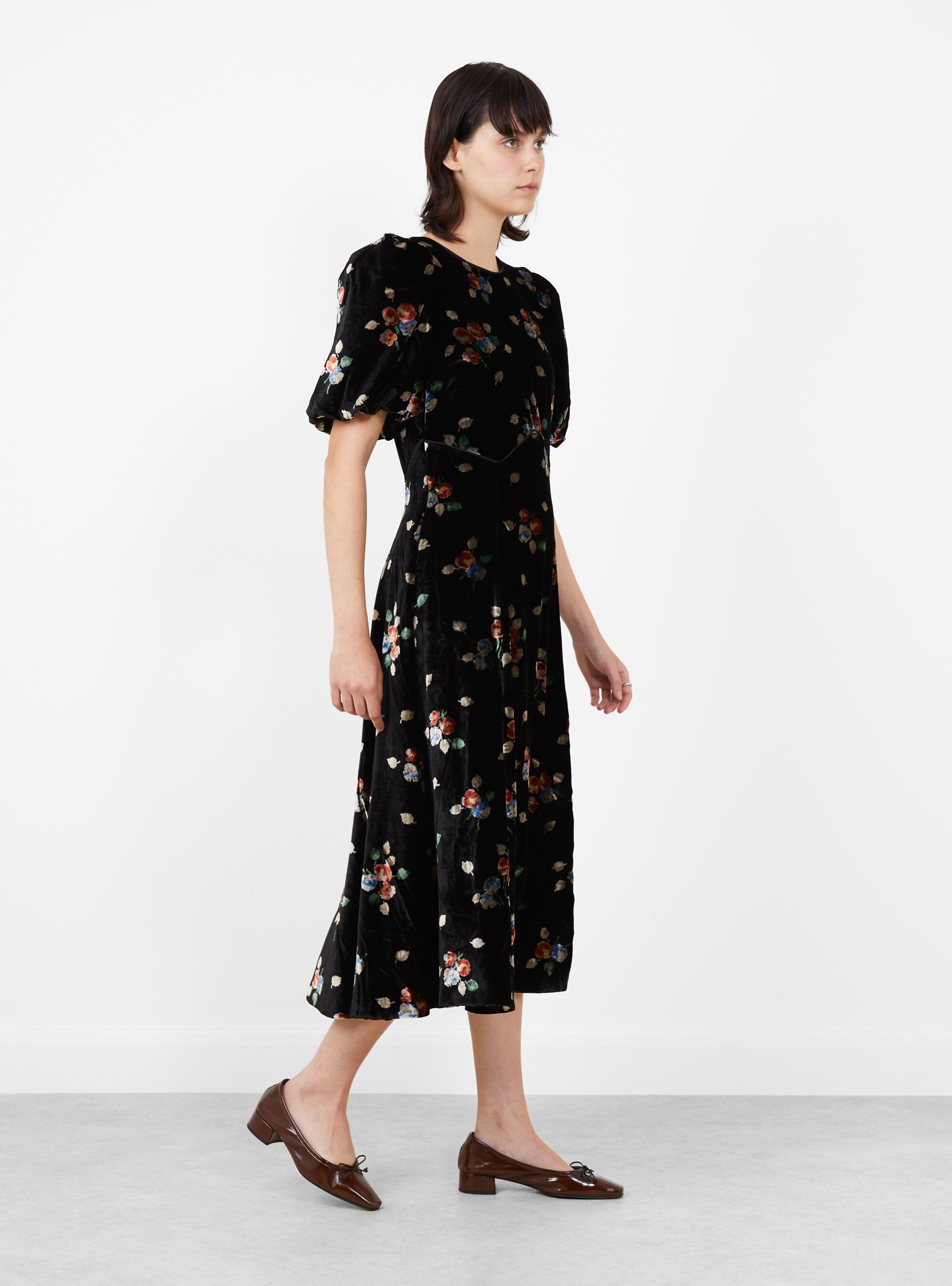 Leda Velvet Puff Sleeve Midi Dress Black Black SEA (model side) at Couverture & The Garbstore