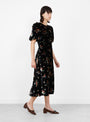 Leda Velvet Puff Sleeve Midi Dress Black Black SEA (model side) at Couverture & The Garbstore