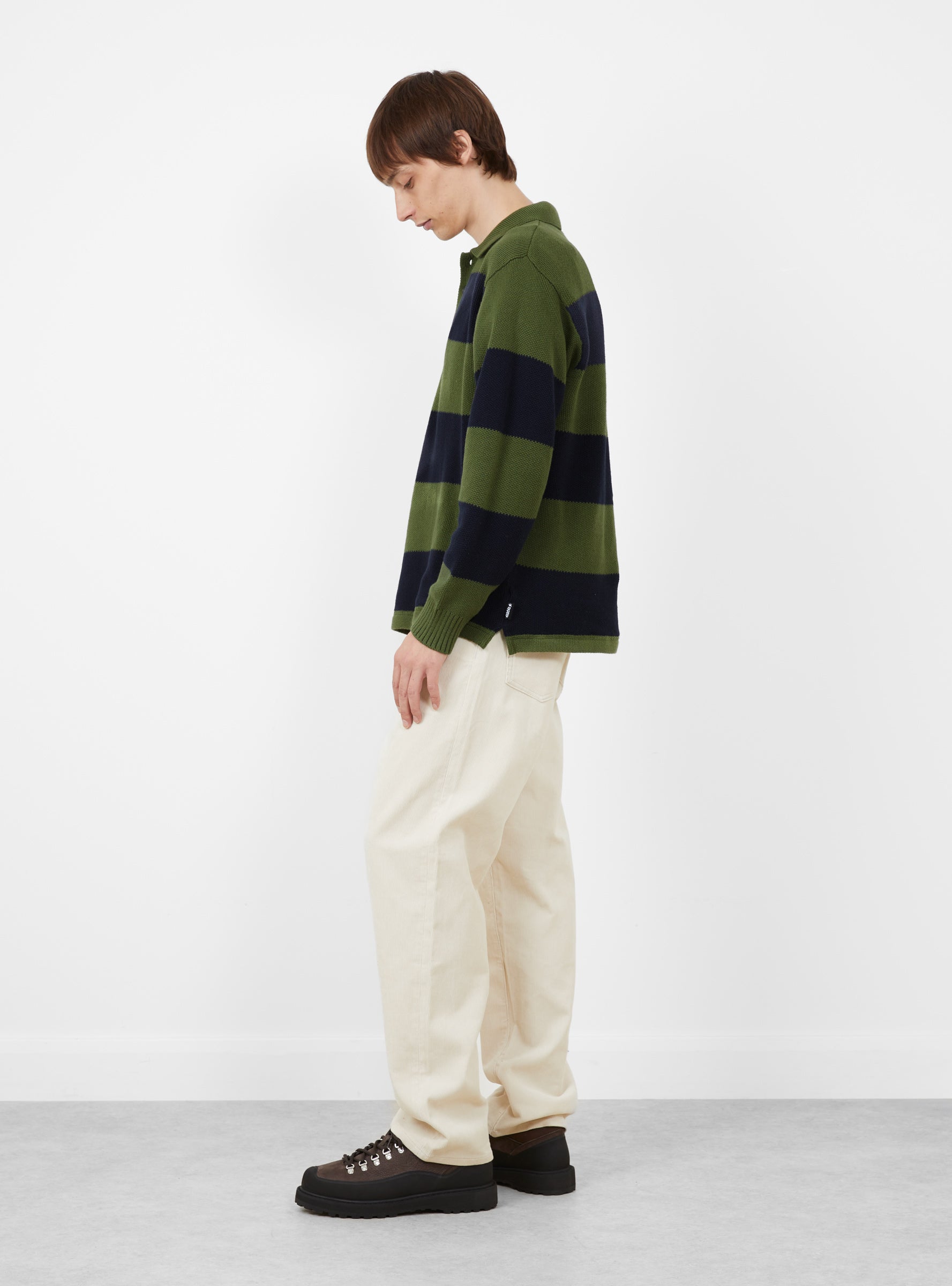 Pique Knit Stripe Rugby Shirt Olive Stussy (modle side) at Couverture & The Garbstore