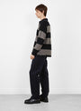 Pique-Knit-Stripe-Rugby-Shirt-Black-Stussy-(model-side) at Couverture & The Garbstore