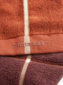 Tiiliskivi Bath Mat Chestnut Marimekko (logo detail) at Couverture & The Garbstore